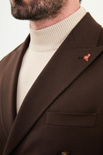 Men wearing chocolate brown slim-fit double-breasted wool-blend suit with peak lapels and cream turtleneck, winter formal outfit.