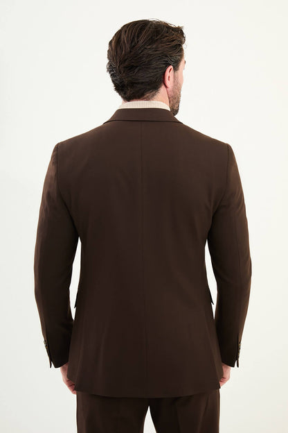 Men wearing chocolate brown slim-fit double-breasted wool-blend suit with peak lapels and cream turtleneck, winter formal outfit.