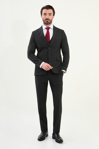 Men’s matte black slim-fit three-piece wool-blend suit with single-breasted jacket, V-neck waistcoat, slim tapered trousers, tonal buttons, and origami lapel pin.