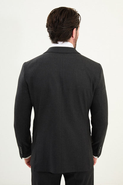 Men’s matte black slim-fit three-piece wool-blend suit with single-breasted jacket, V-neck waistcoat, slim tapered trousers, tonal buttons, and origami lapel pin.