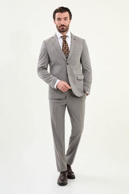 Men’s light gray slim-fit three-piece wool-blend winter suit with single-breasted jacket, notch lapels, matching waistcoat, dark buttons, and black origami lapel pin.