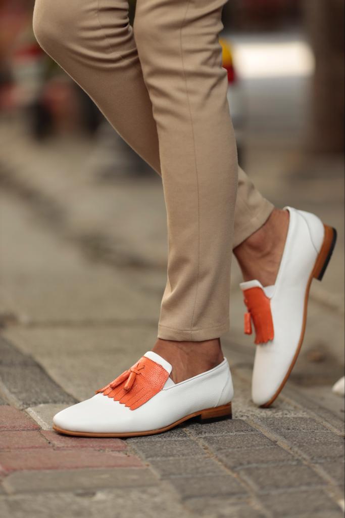 Empire White Kilt Tassel Slip-Ons: Elegance Redefined